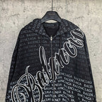 Balenciaga zip-up hoodie close-up, black with repeating text and bold white script logo