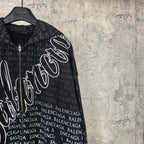Side close-up of dark long-sleeve zip hoodie sleeve with Balenciaga text and logo graphic.