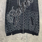 Balenciaga zip-up hoodie close-up, black with bold white script and repeating BALENCIAGA text