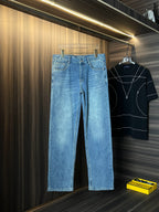 Versace light-wash wide-leg denim jeans with button waistband and back patch detail