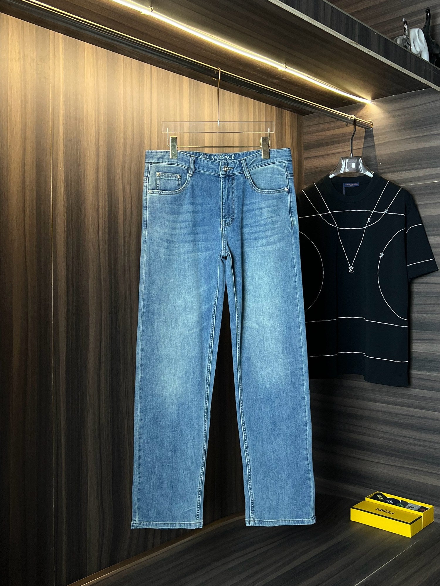 Versace light-wash wide-leg denim jeans with button waistband and back patch detail