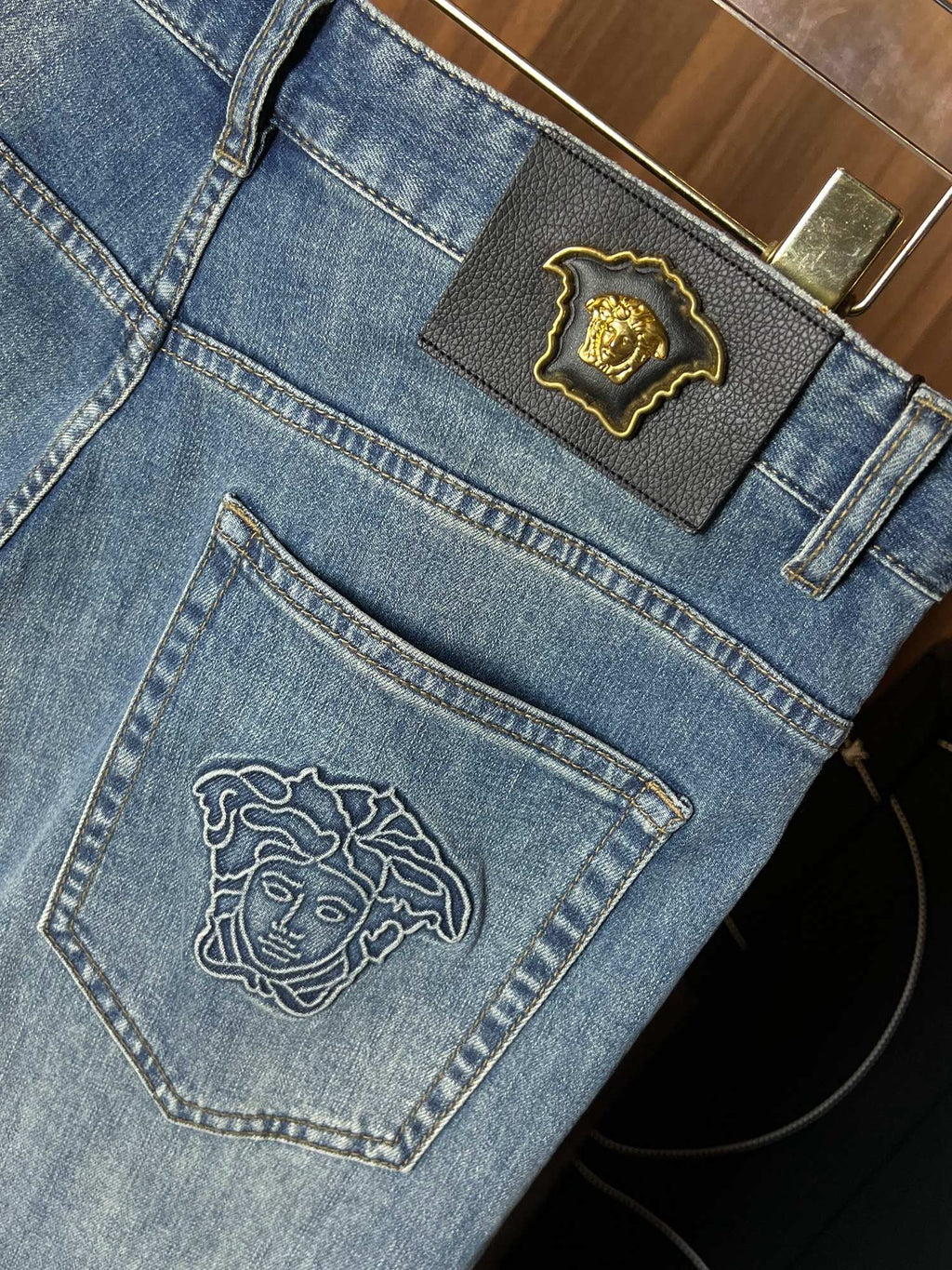 Light blue denim jeans close-up of back pocket and top patch emblem
