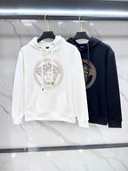Versace hoodies on hangers: white and dark navy, each with Medusa print
