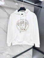 White hooded sweatshirt with drawstrings and large circular Medusa rhinestone print