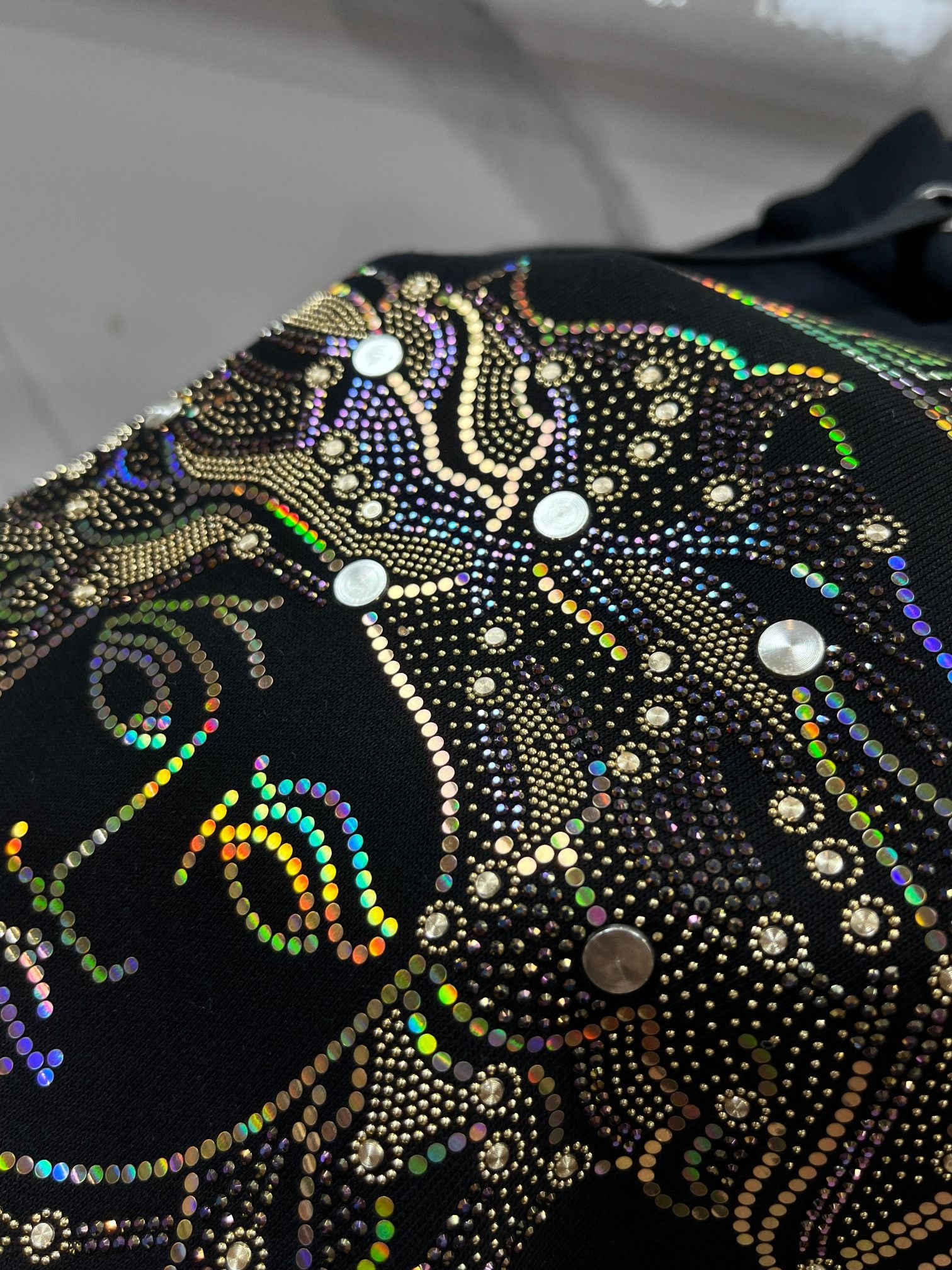 Versace Medusa bead-embellished artwork on dark navy hoodie front