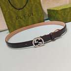 Gucci leather belt, dark brown, with round silver-tone GG buckle and keeper holes.