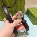 Gucci belt in dark brown leather with silver-tone GG buckle clasp, strap end shown.