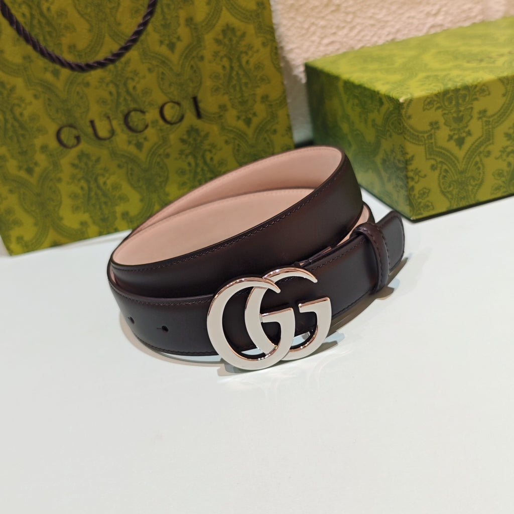 Brown leather belt with curved silver double-G buckle