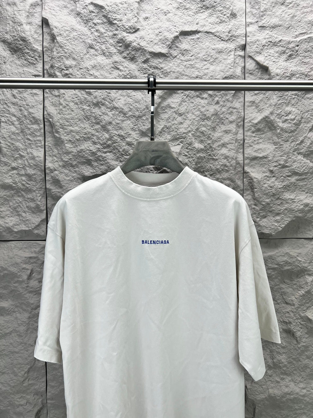 White short-sleeve T-shirt with small Balenciaga logo on front