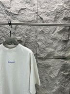 White short-sleeve T-shirt with small Balenciaga logo, crew neck