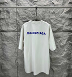 White short-sleeve T-shirt with blue Balenciaga logo on back