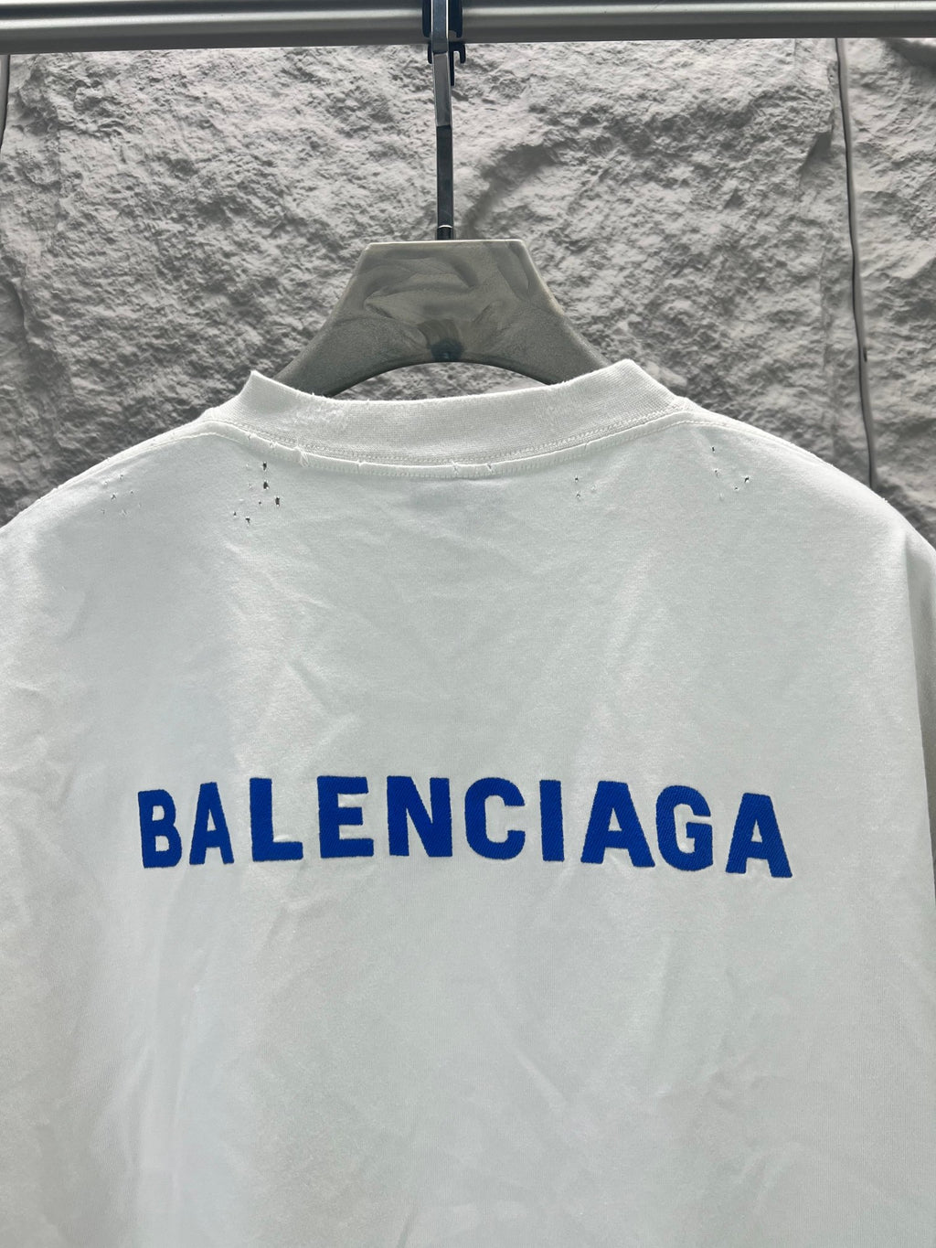 White T-shirt back with large blue Balenciaga lettering