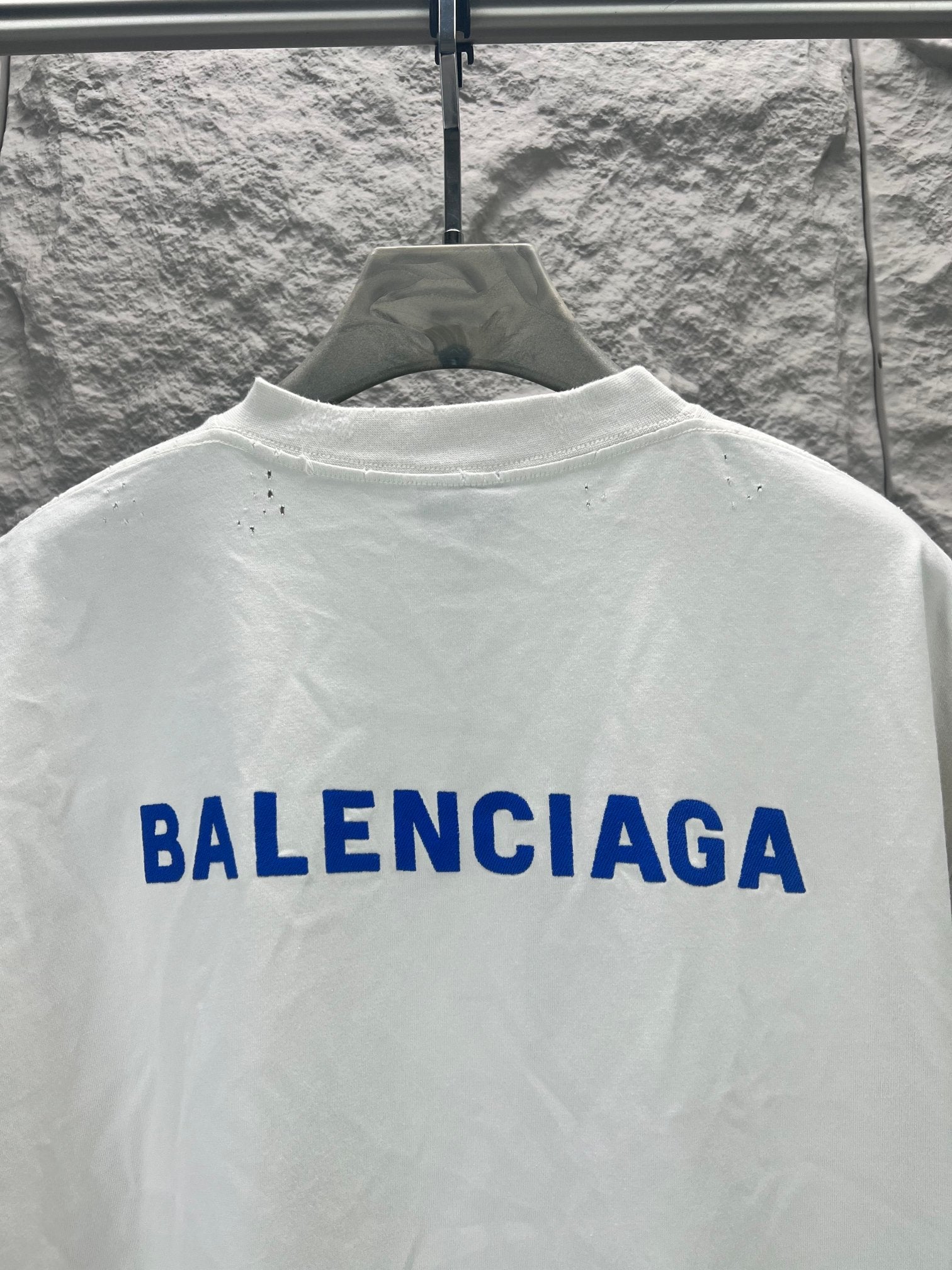 White T-shirt back with large blue Balenciaga lettering