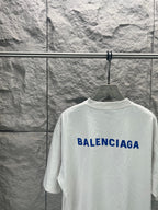 White short-sleeve T-shirt with blue Balenciaga logo on back