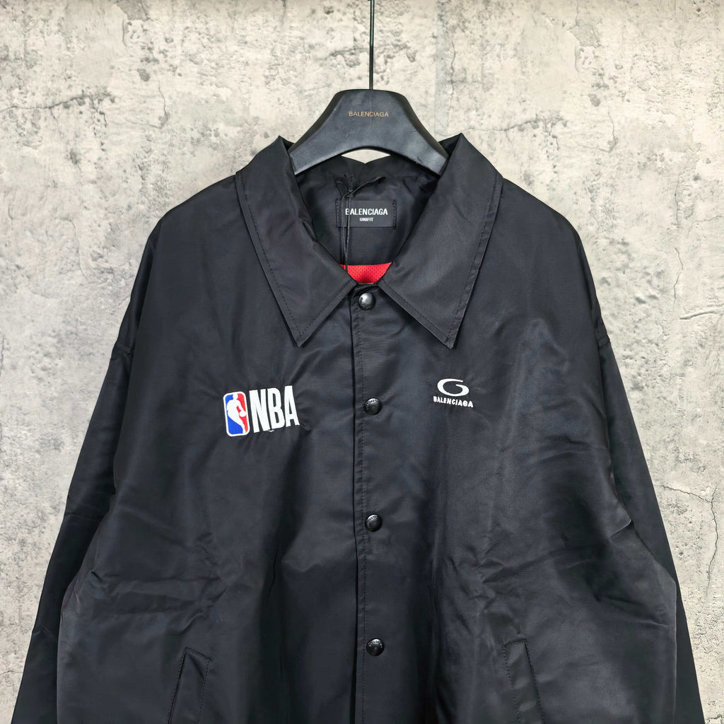 Dark navy jacket front with button placket, spread collar, NBA patch and G logo