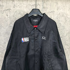 Dark navy jacket front with button placket, spread collar, NBA patch and G logo
