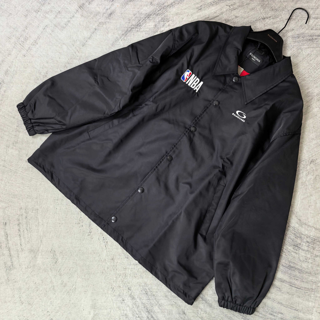 Dark navy jacket laid flat with button placket, spread collar, NBA patch and G logo
