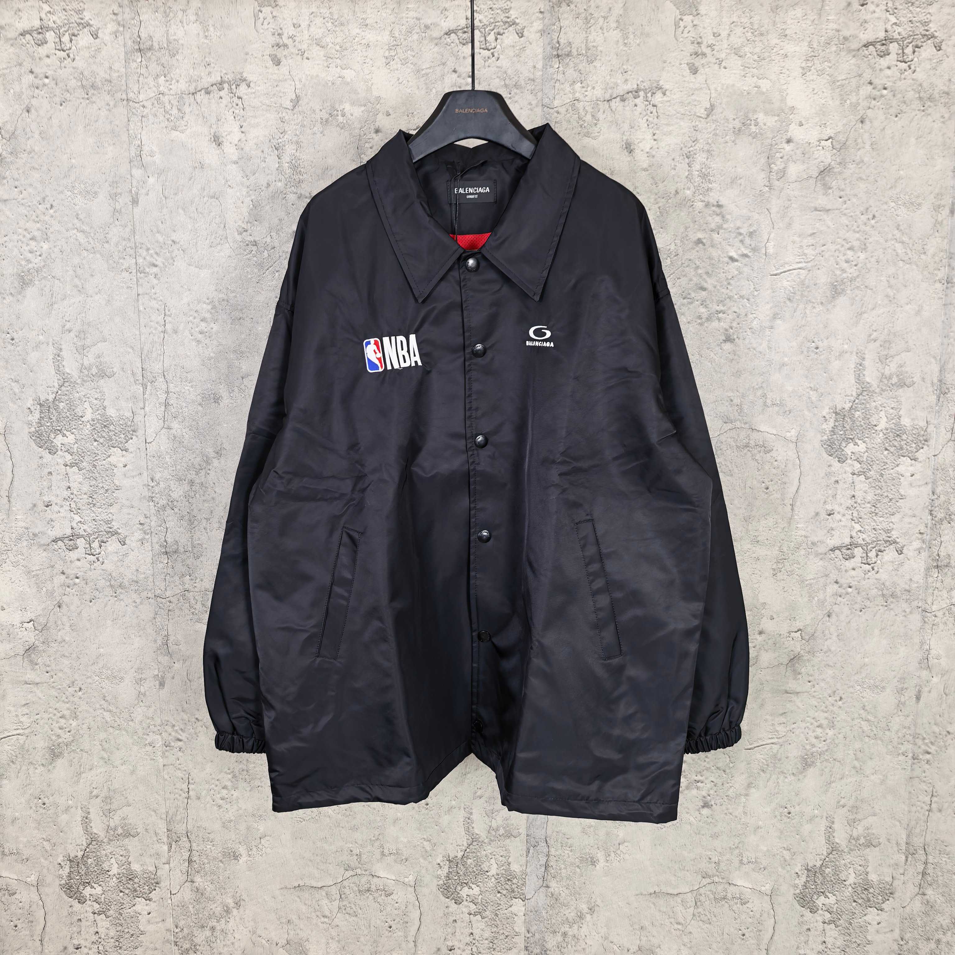Dark navy long-sleeve jacket with button front, spread collar, NBA patch and logo