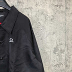 Dark navy jacket sleeve with small G logo