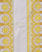 Versace shirt close-up of white button and yellow baroque side stripe panel