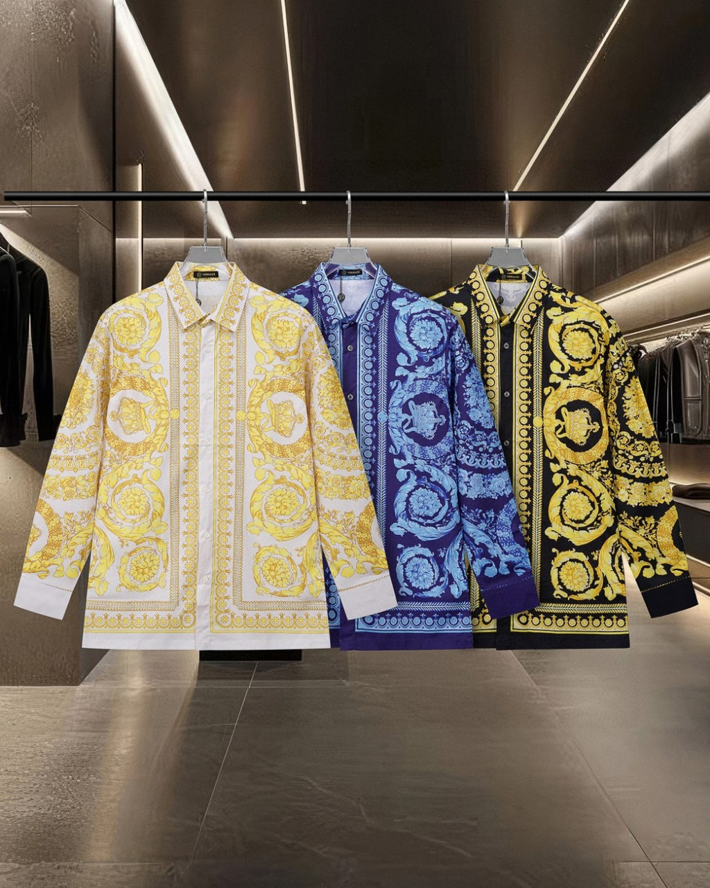 Versace long-sleeve button-up shirts in yellow, blue, and dark with baroque prints