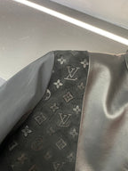 Louis Vuitton monogram pattern inset on black jacket sleeve/side panel