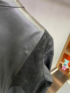 Louis Vuitton monogram windbreaker sleeve panel, dark gray with subtle pattern