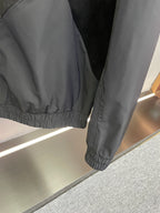 Louis Vuitton monogram windbreaker jacket, dark gray, elastic cuffs, close-up