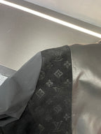 Black jacket sleeve panel with Louis Vuitton monogram print