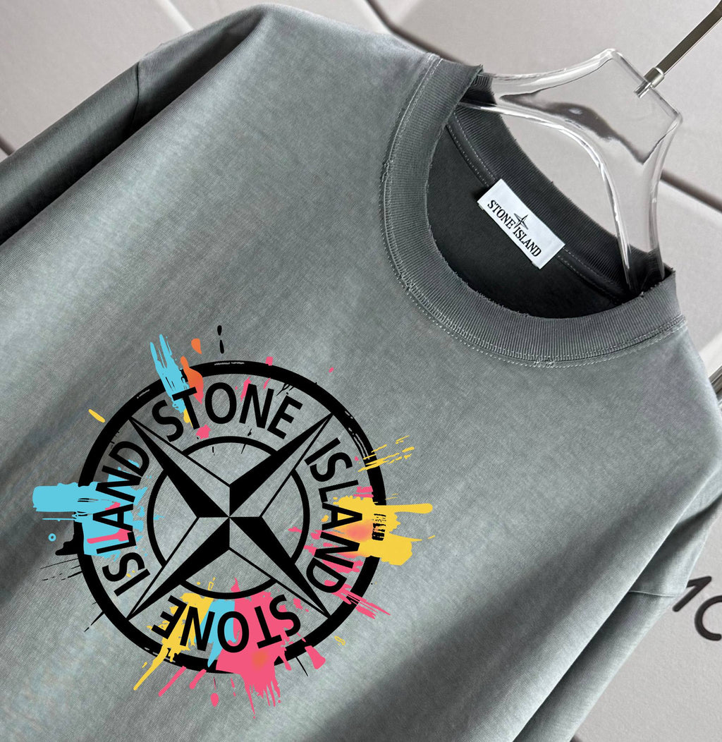 Grey crewneck T-shirt close-up with Stone Island-style logo and neck label