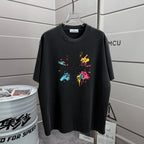 Black T-shirt with colorful splatter graphic on the front