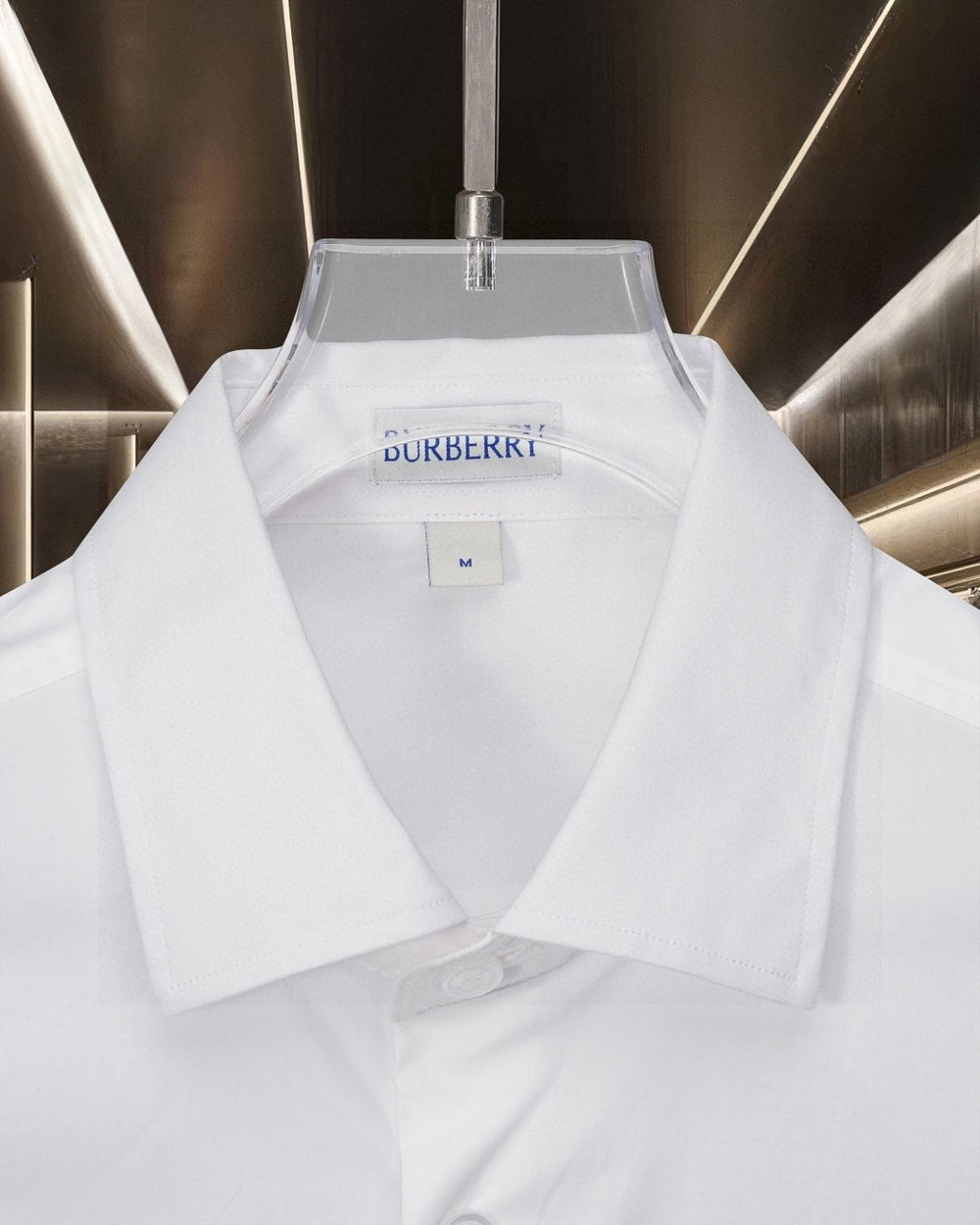 White Burberry button-up shirt with point collar and logo at the neckline