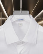 White Burberry button-up shirt with point collar and logo at the neckline