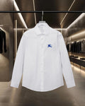 White Burberry button-up shirt with point collar and blue polo logo
