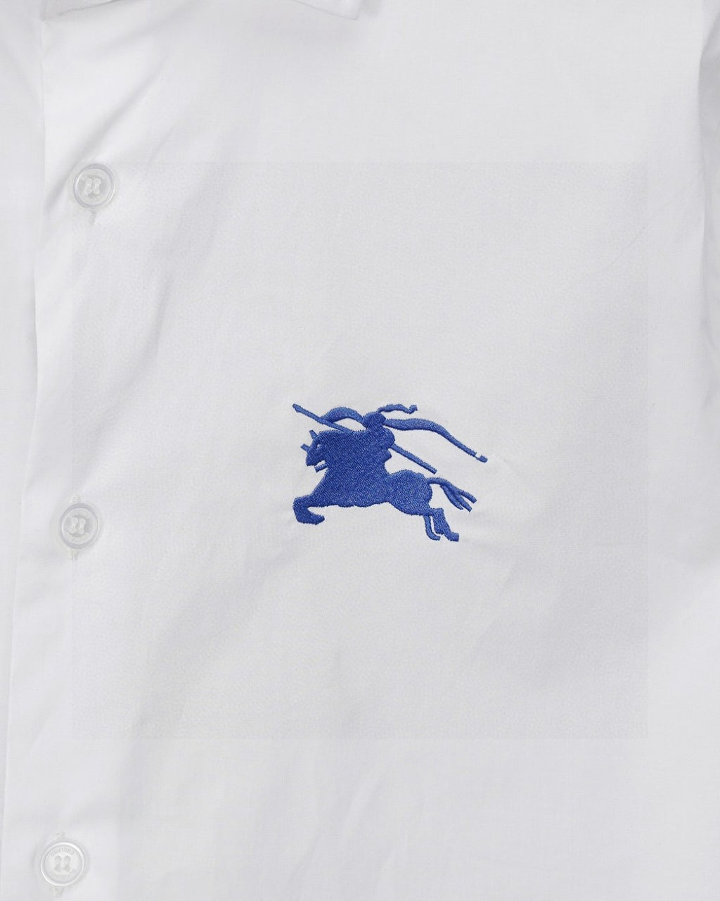 White Burberry shirt with blue horse rider emblem and buttoned placket
