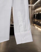 White Burberry button-up shirt sleeve and side hem with buttons
