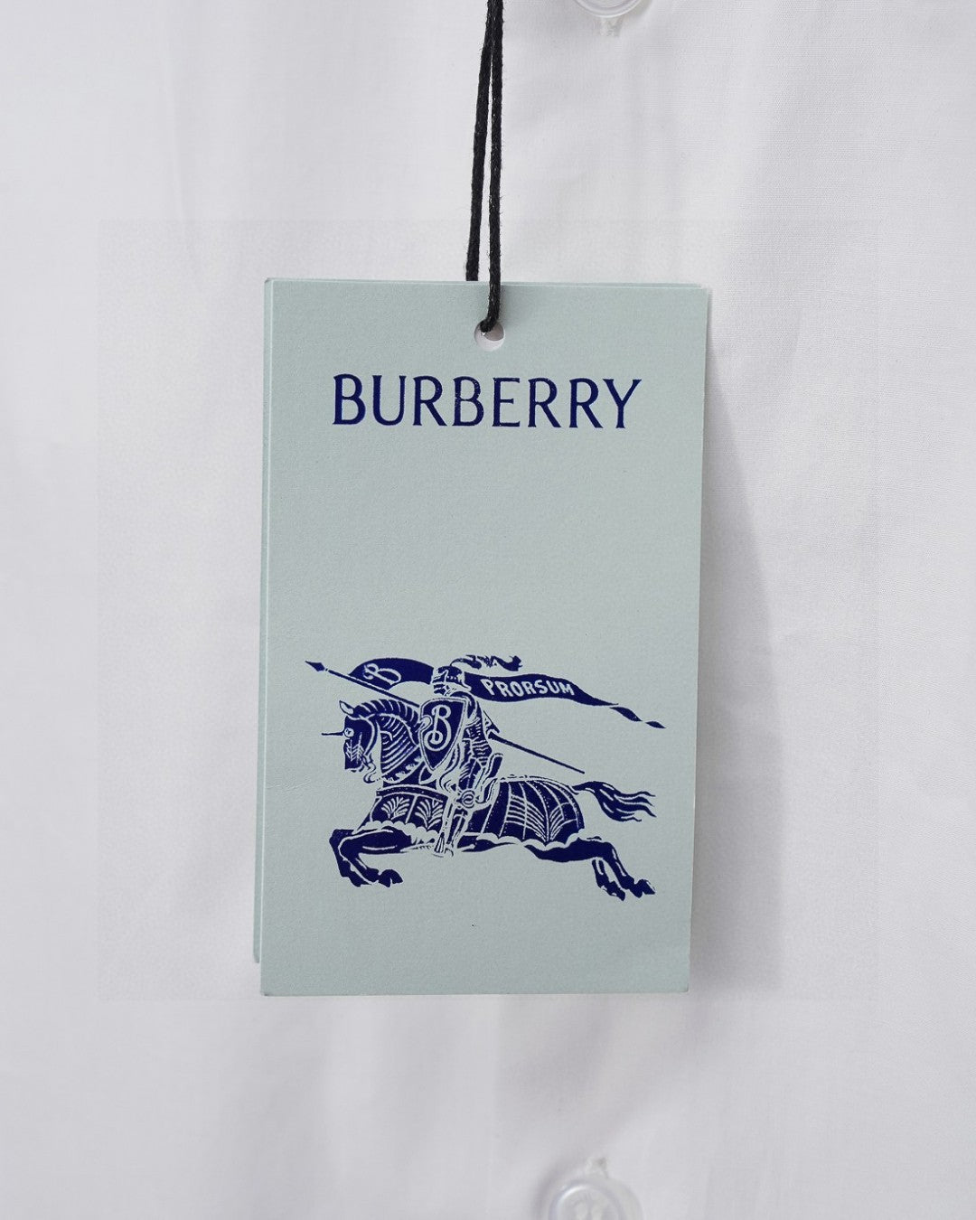 Burberry clothing tag with blue equestrian rider logo