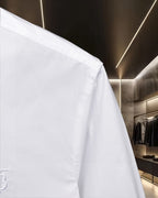 White Burberry long-sleeve dress shirt side view with shoulder and sleeve seam