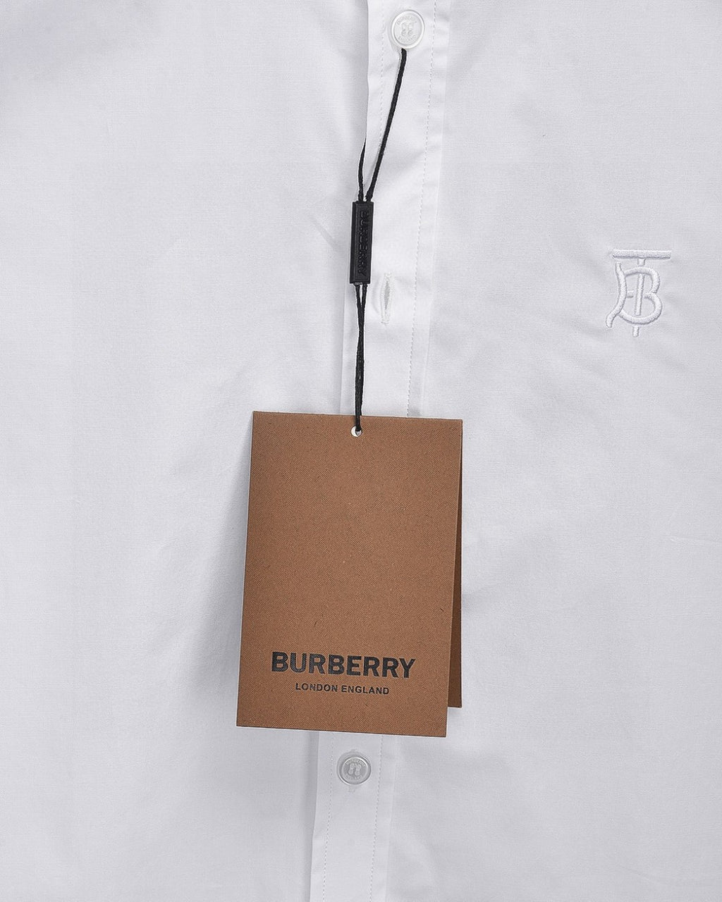 White Burberry dress shirt with hanging Burberry tag and front buttons
