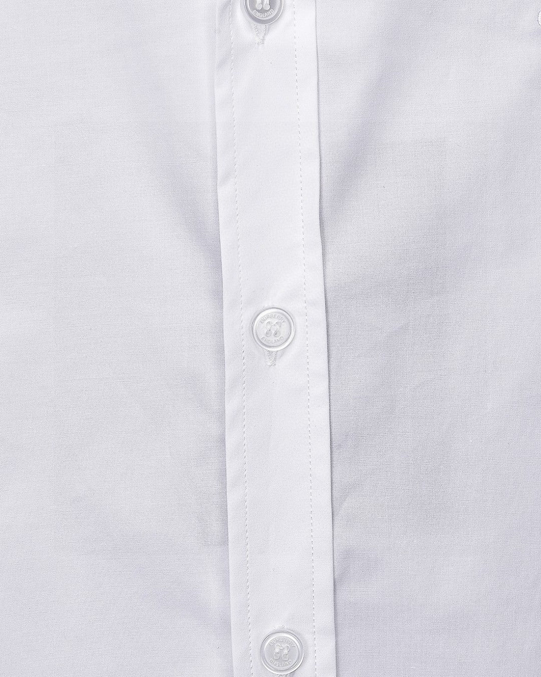 White Burberry dress shirt front placket detail with buttons