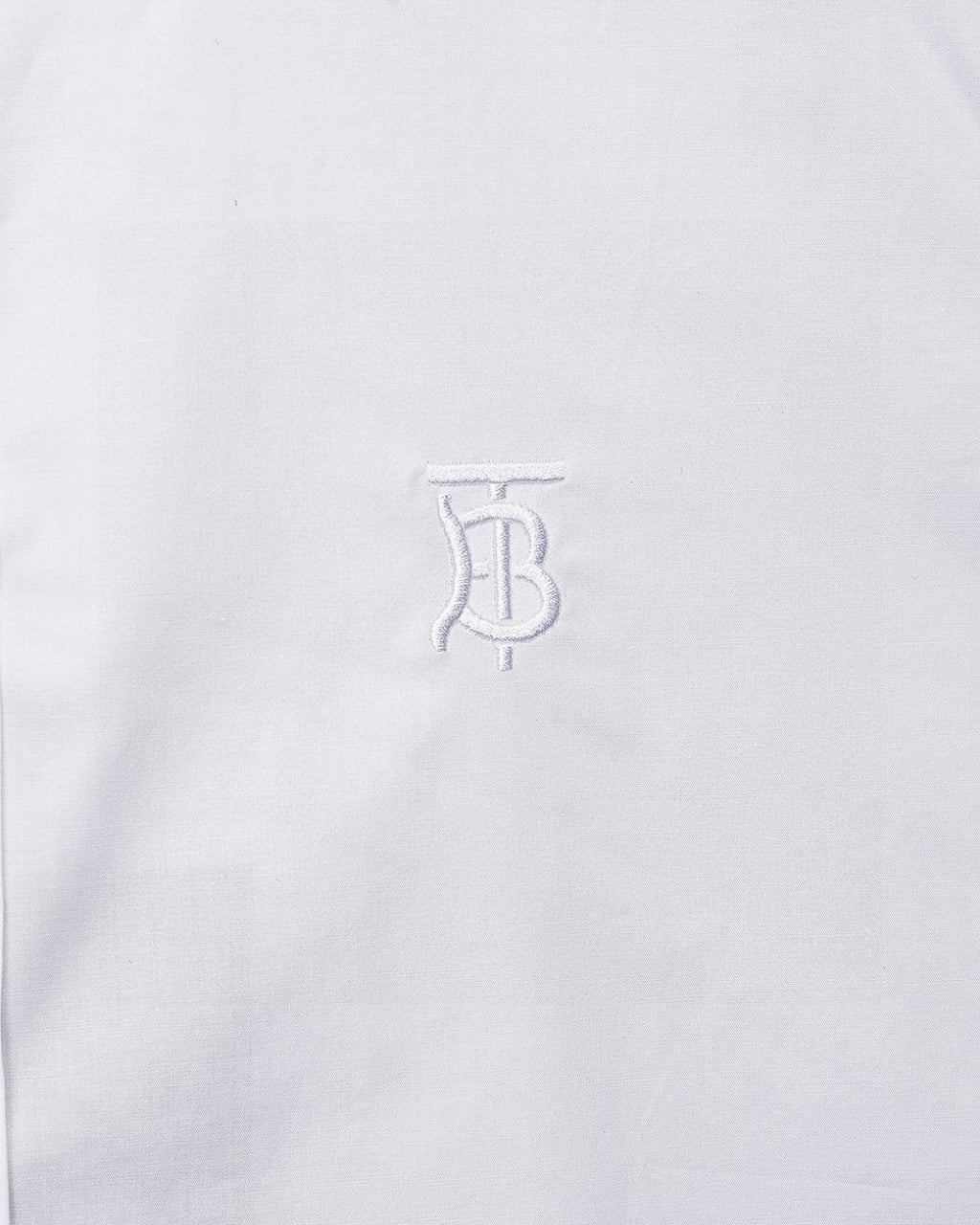 White Burberry dress shirt chest with embossed TB logo