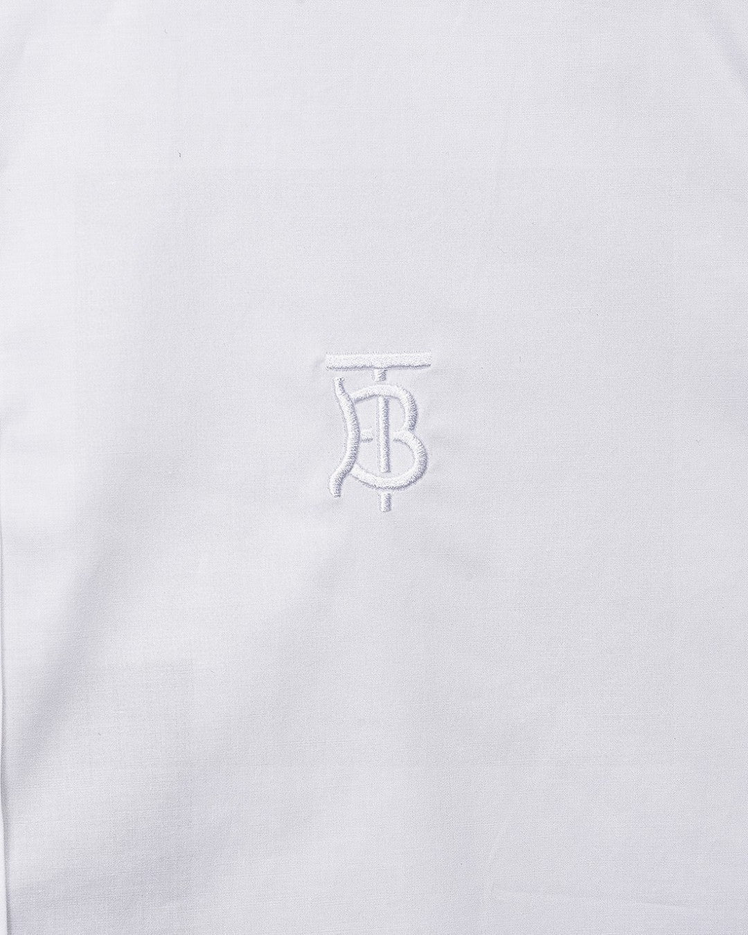 White Burberry dress shirt chest with embossed TB logo