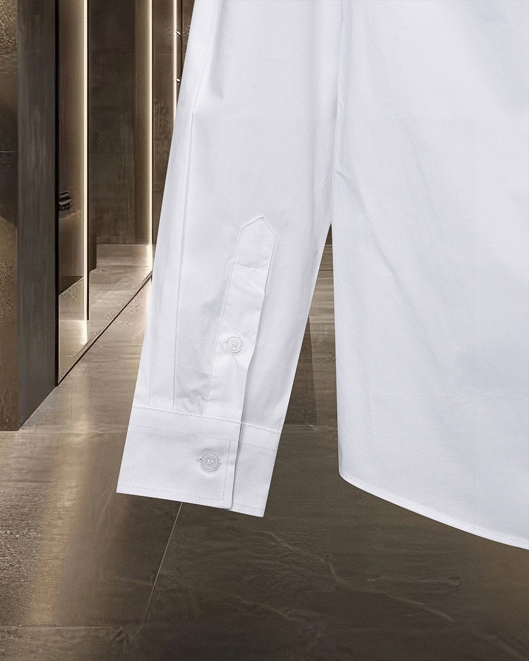White long-sleeve button-up shirt with buttoned placket