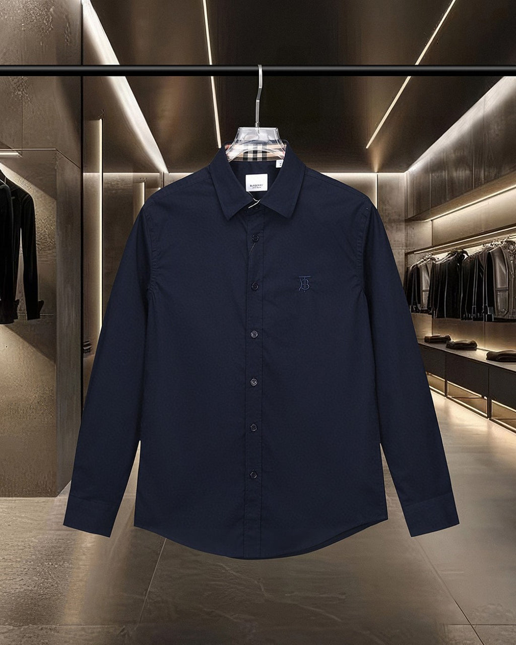 Navy long-sleeve button-up shirt with point collar and small chest logo