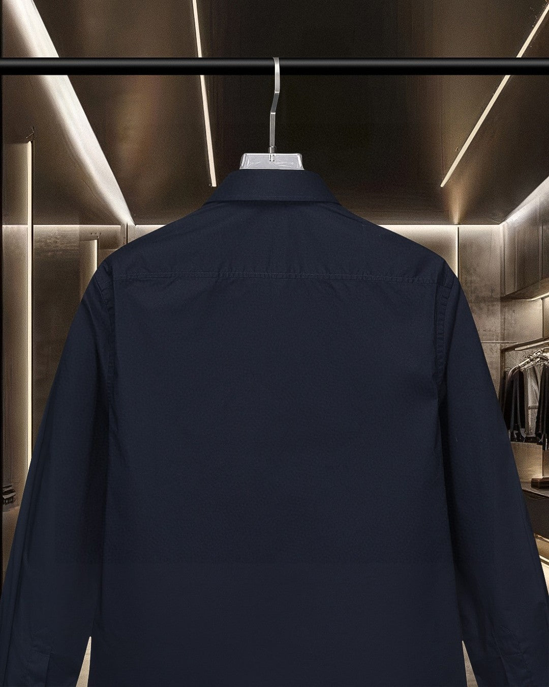 Navy long-sleeve button-up shirt back close-up on hanger