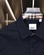 Navy Burberry button-up shirt with point collar and check inner neckline