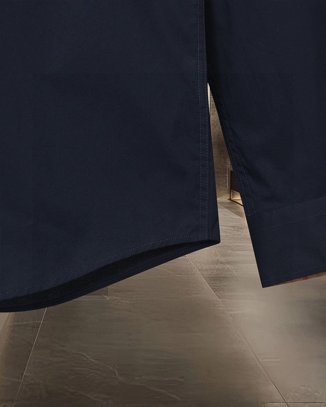 Navy button-up shirt hem and cuff detail, long sleeve
