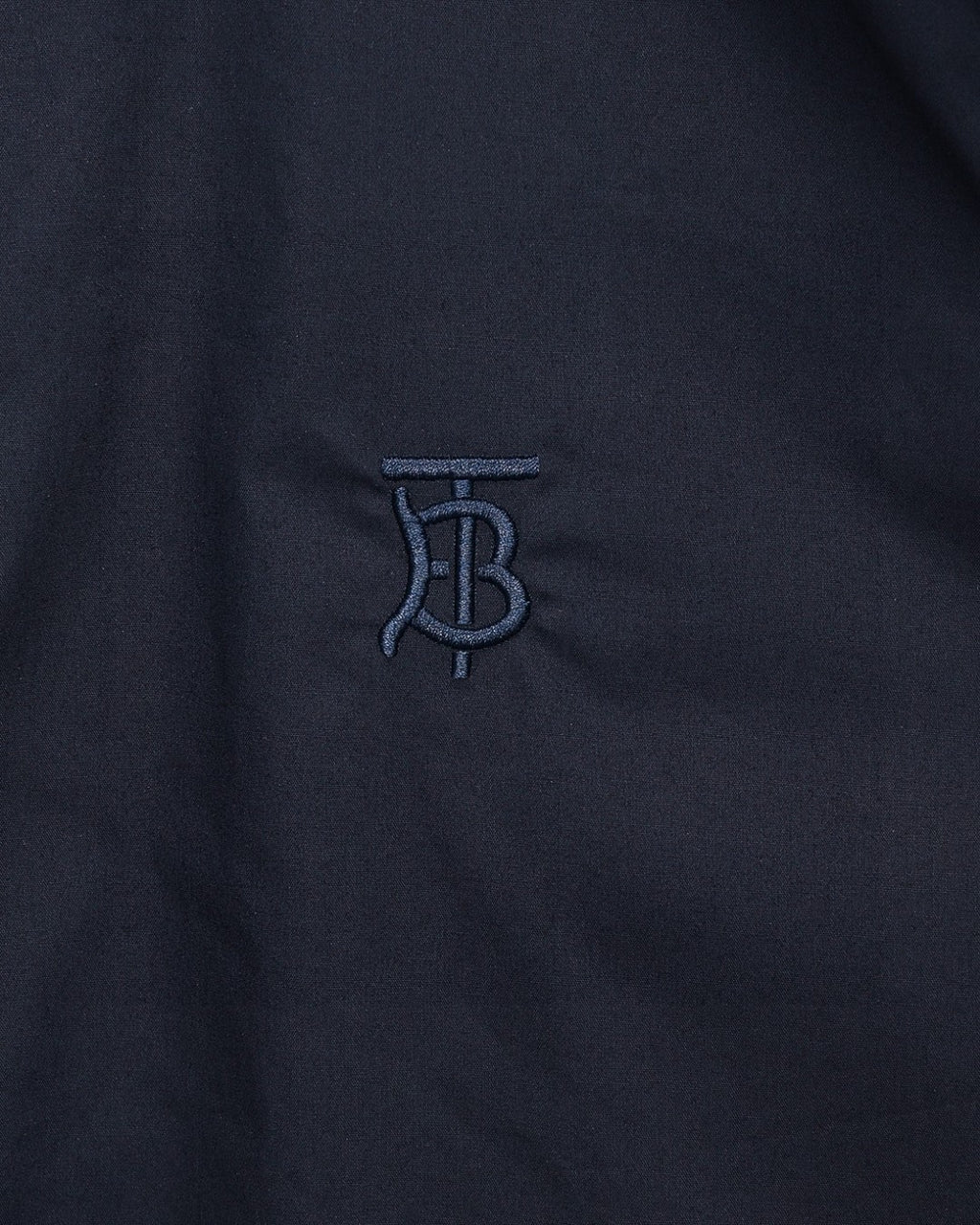 Navy Burberry TB logo embroidery on chest of button-up shirt