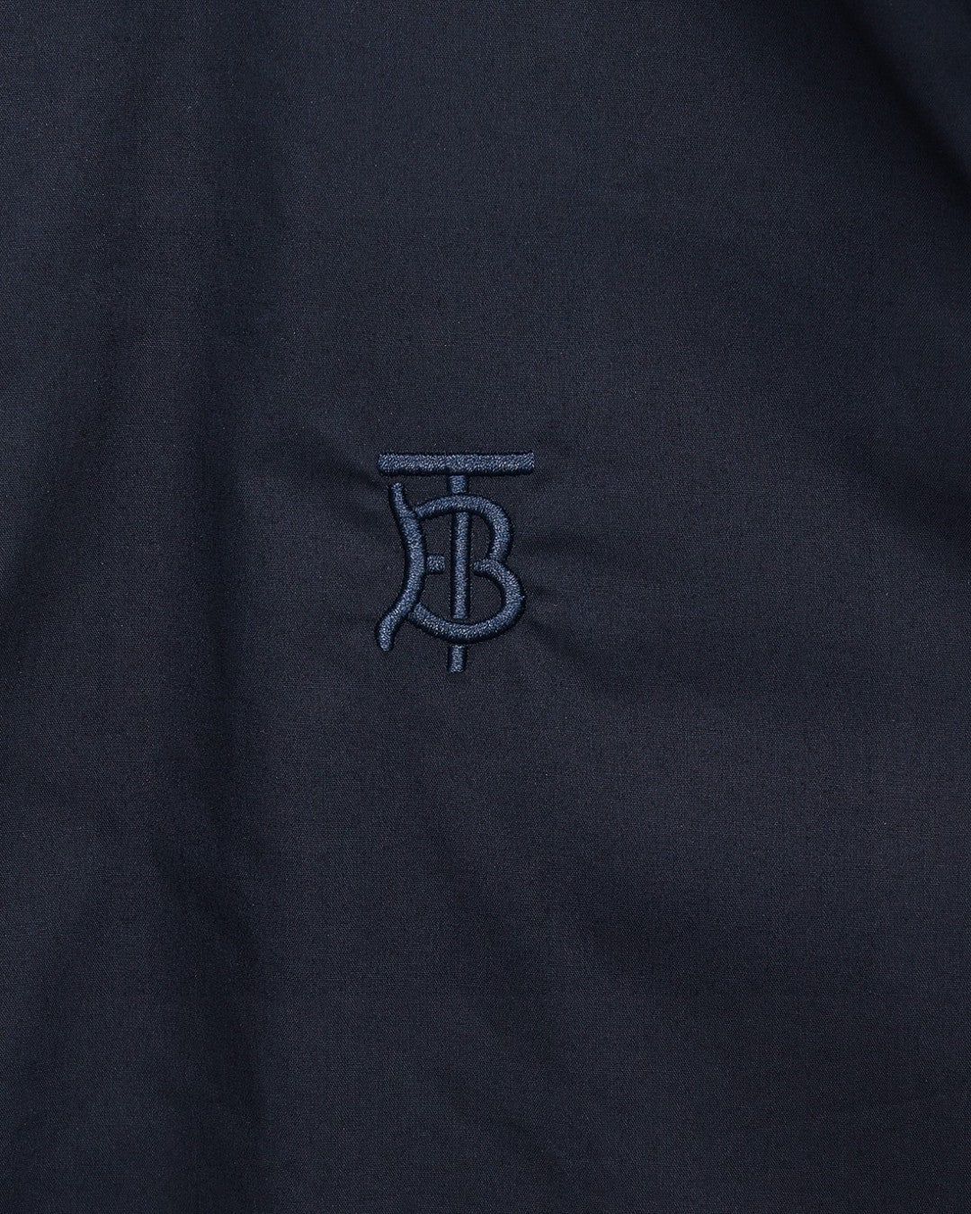 Navy Burberry TB logo embroidery on chest of button-up shirt