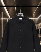 Burberry long-sleeve button-up shirt, front view with point collar and buttons